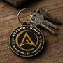Porte-clé Academy Ninja en PVC souple, logo doré sur fond noir